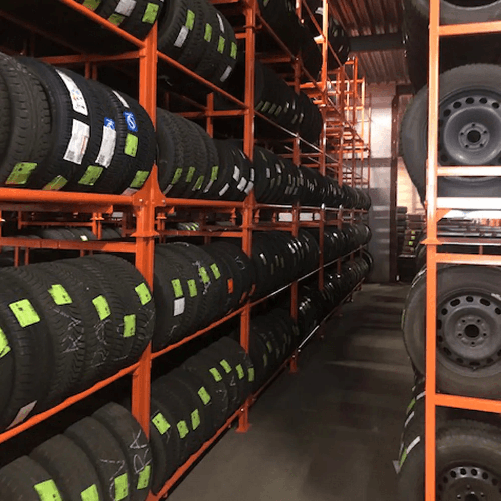 Racks of tyres stacked in a warehouse